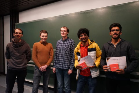 The team that came second in the Tensor Tournament T3, holding their awards at the ceremony.