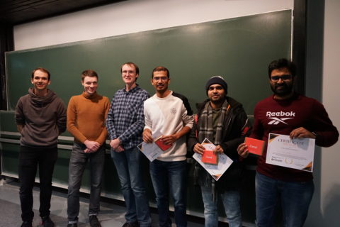 The team that came third in the Tensor Tournament T3, holding their awards at the ceremony.